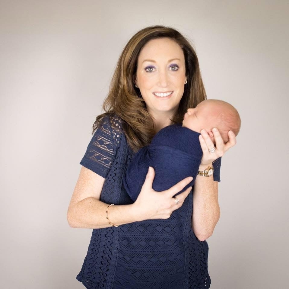 Julie holding a newborn baby